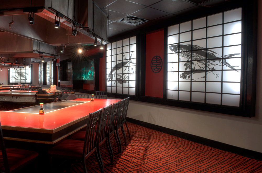 Inside Makoto Japanese Steakhouse with illustrated acrylic panels on wall 2