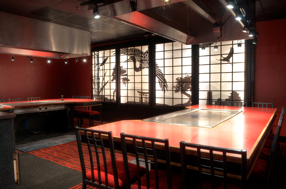 Inside Makoto Japanese Steakhouse with illustrated acrylic panels on wall 5